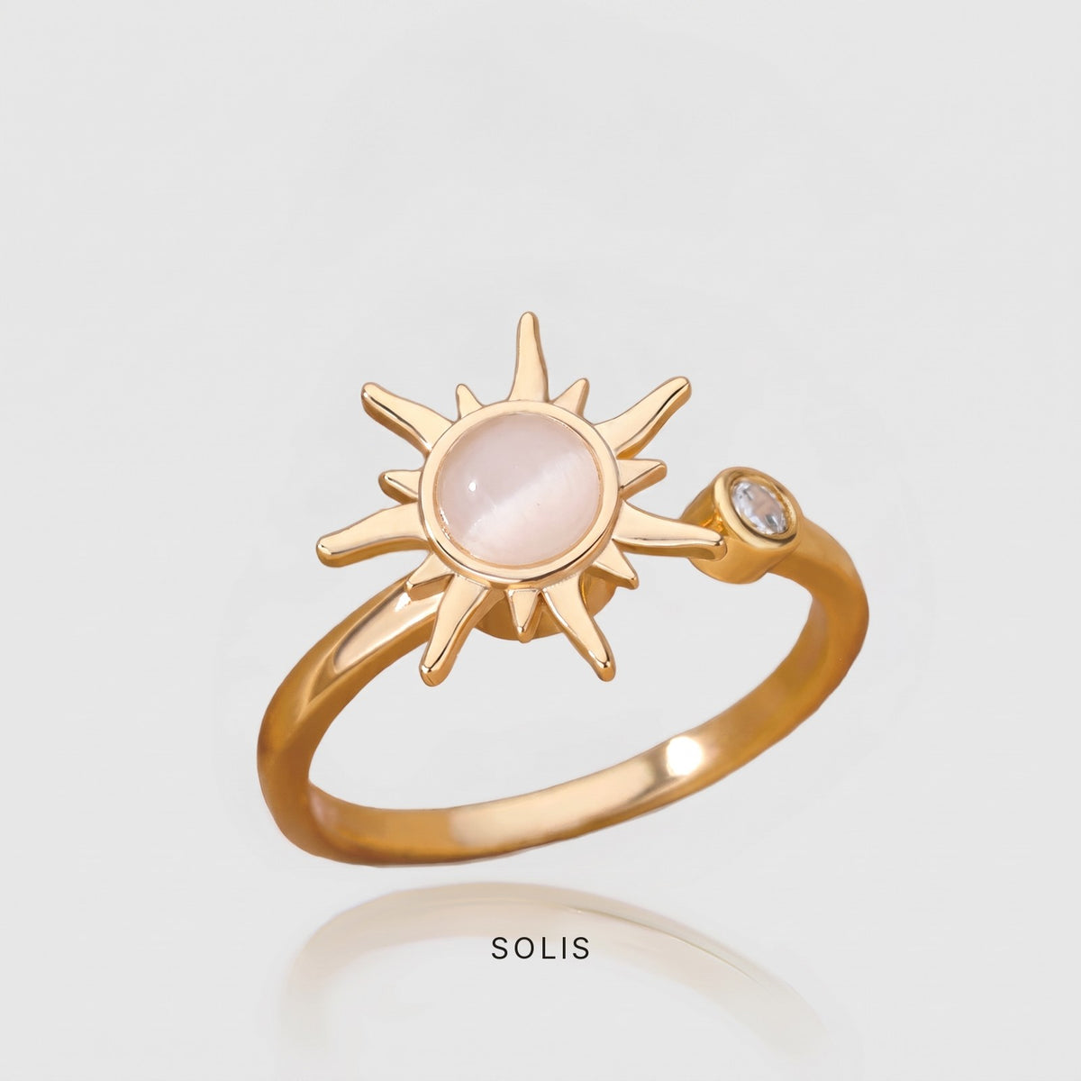 LUGNA Calm Ring Solis in gold, spinning sun charm with a moonstone