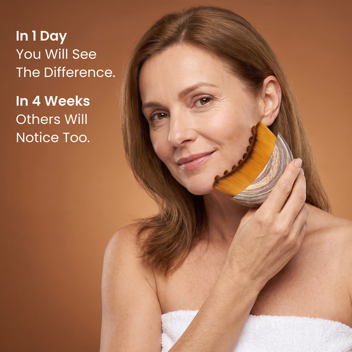 A woman with mature skin brushing upward along her jawline with the LYFTA brush