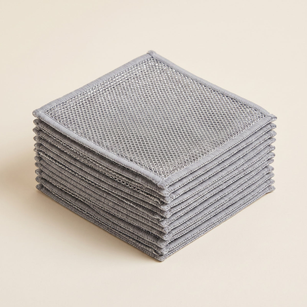 SKRUBBA Mesh Scrub Cloths in Silver, stack of cloths